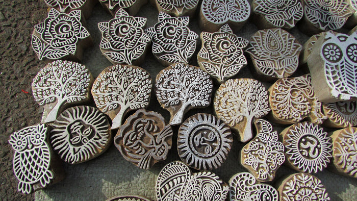 Small carved blocks used to fill colour into a design