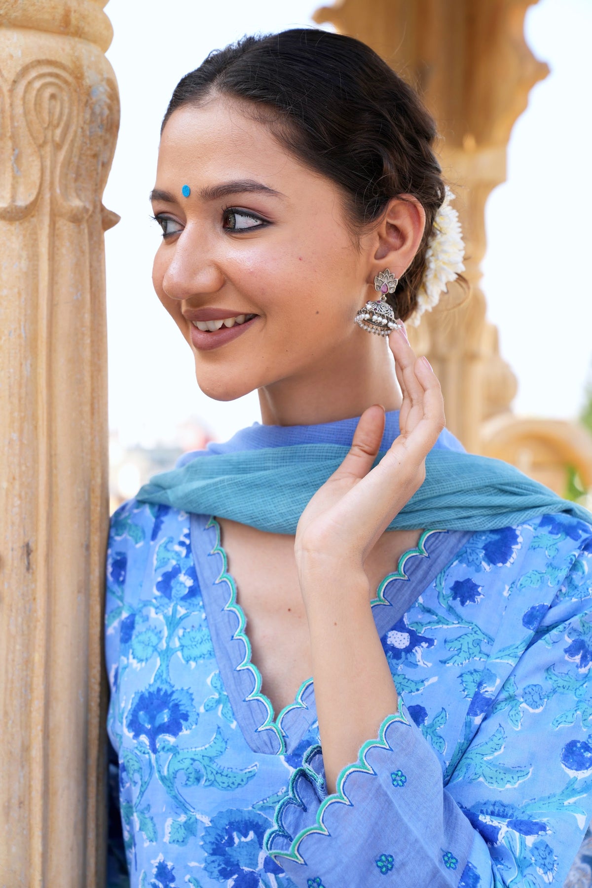 Hand block printed blue floral kurta set, photographed in the sandstone arches of Rajasthan